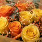 Close-up of yellow and orange roses with orange gypsophila - Summer Time by AIWA Flowers