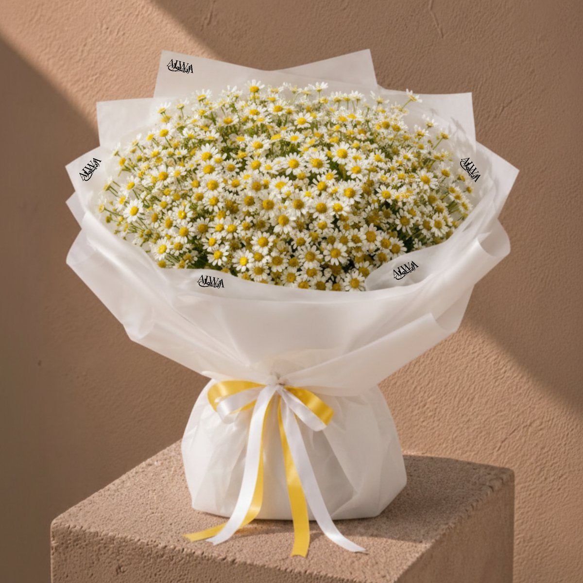 White daisy bouquet with yellow centers by AIWA Flowers Dubai
