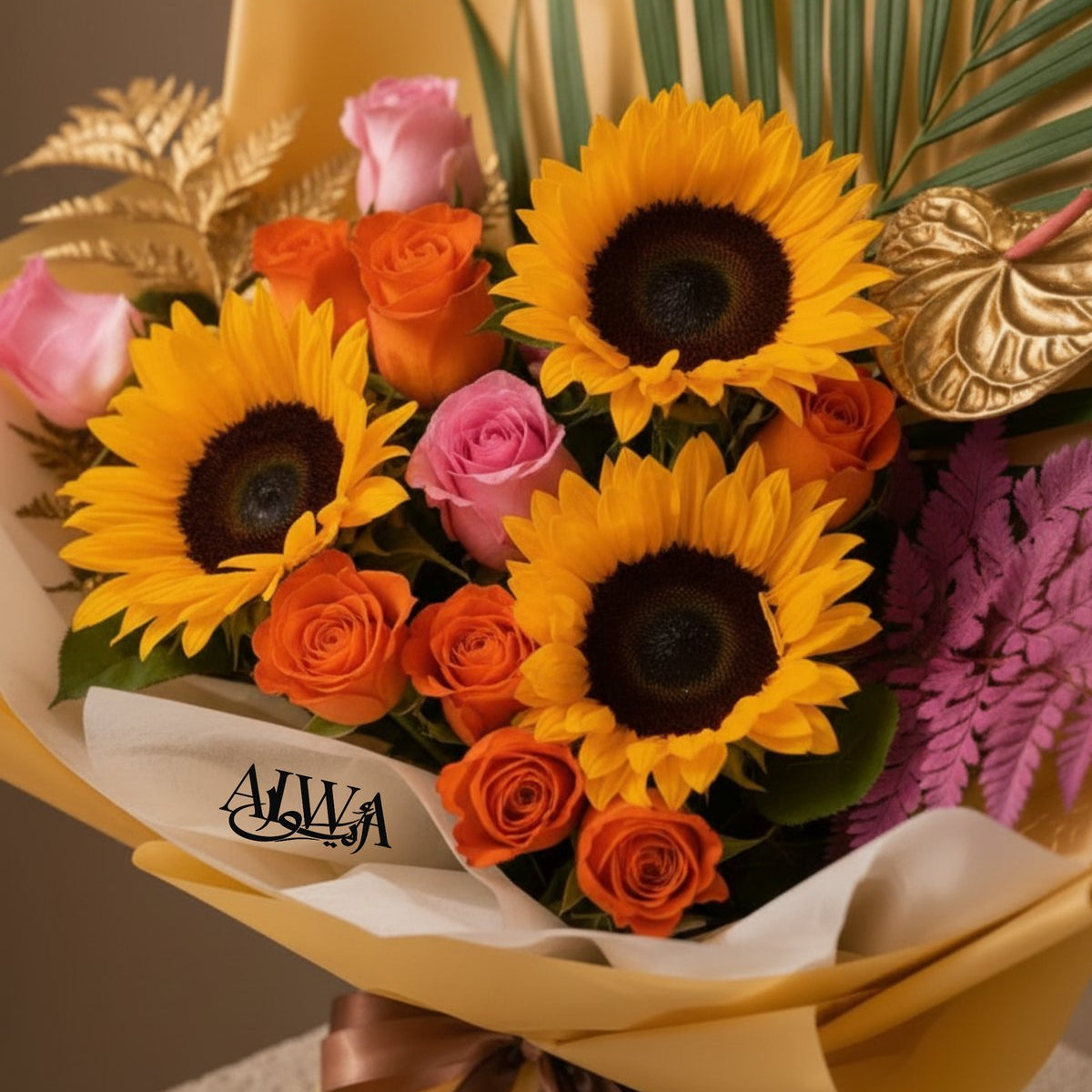 Close-up of sunflowers, orange and pink roses with golden anthurium by AIWA Flowers