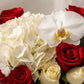 Close-up of white orchid, hydrangea and red & white roses - Swan by AIWA Flowers