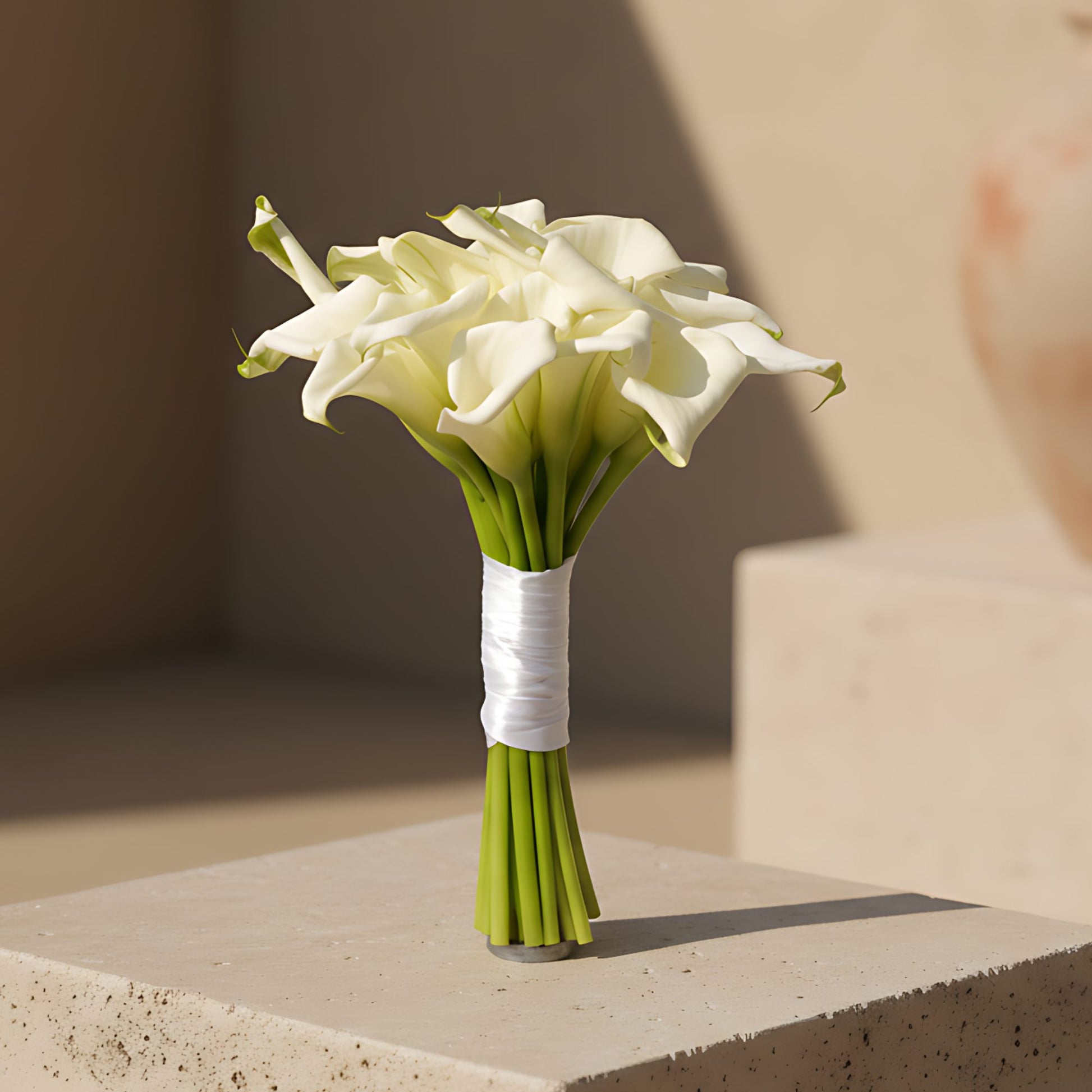 Symphony bridal bouquet made of white calla lilies by Aiwa Flowers