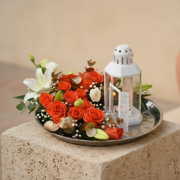 Tafsir floral tray arrangement with orange roses, white lilies, lisianthus, eucalyptus and lantern