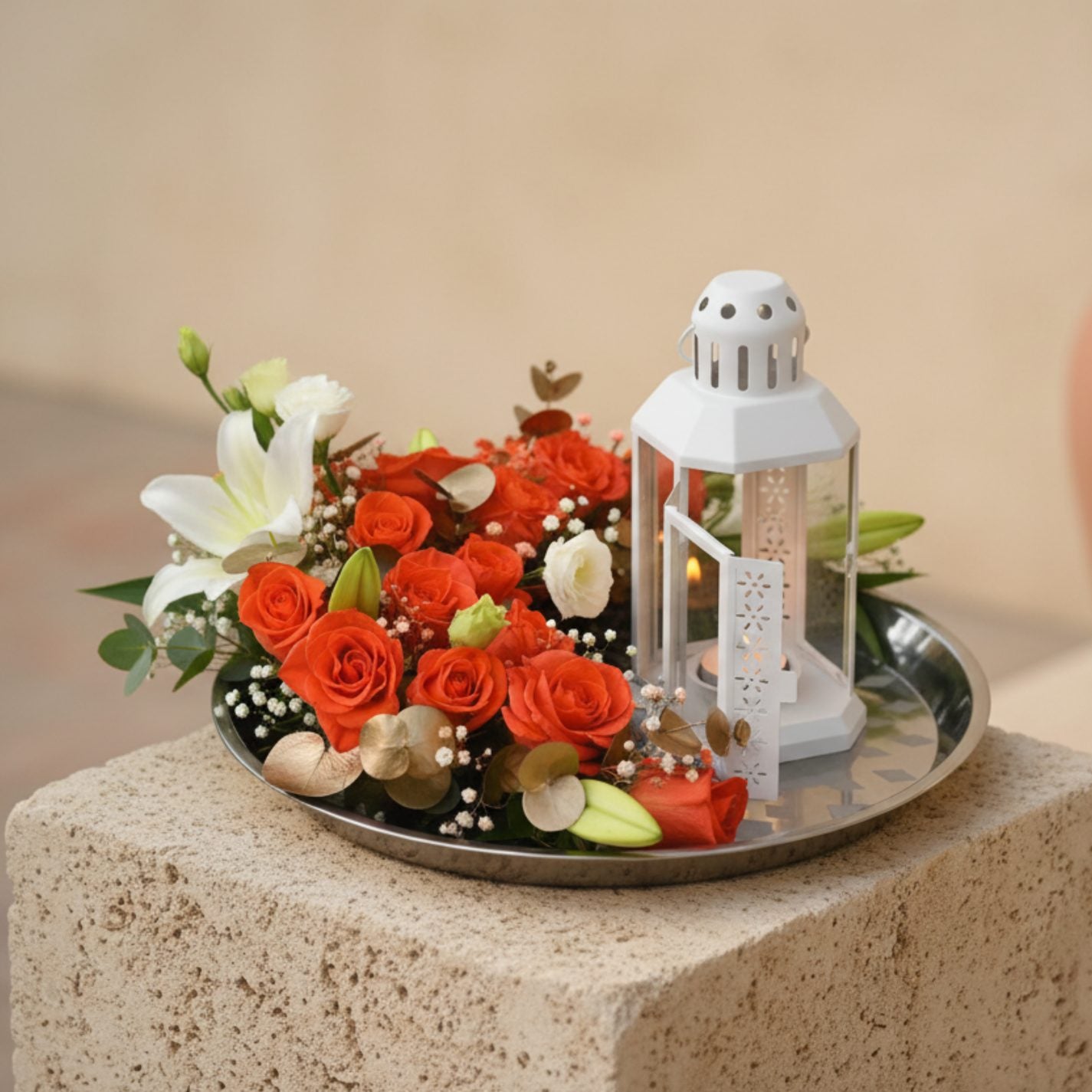 Tafsir floral tray arrangement with orange roses, white lilies, lisianthus, eucalyptus and lantern