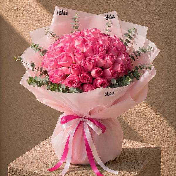 Domed bouquet of 40-50 deep pink roses with eucalyptus in pink wrap - Thrill by AIWA Flowers
