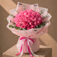Domed bouquet of 40-50 deep pink roses with eucalyptus in pink wrap - Thrill by AIWA Flowers