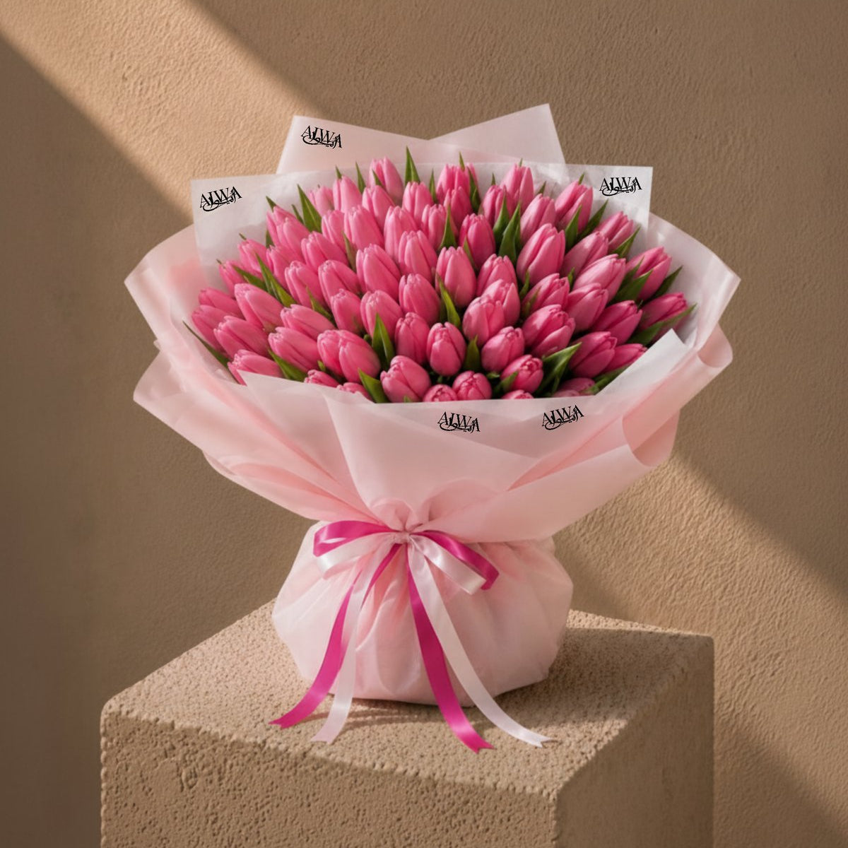 Grand pink tulip hand-tied bouquet in blush wrap with pink ribbon - Tulip Tapestry by AIWA Flowers