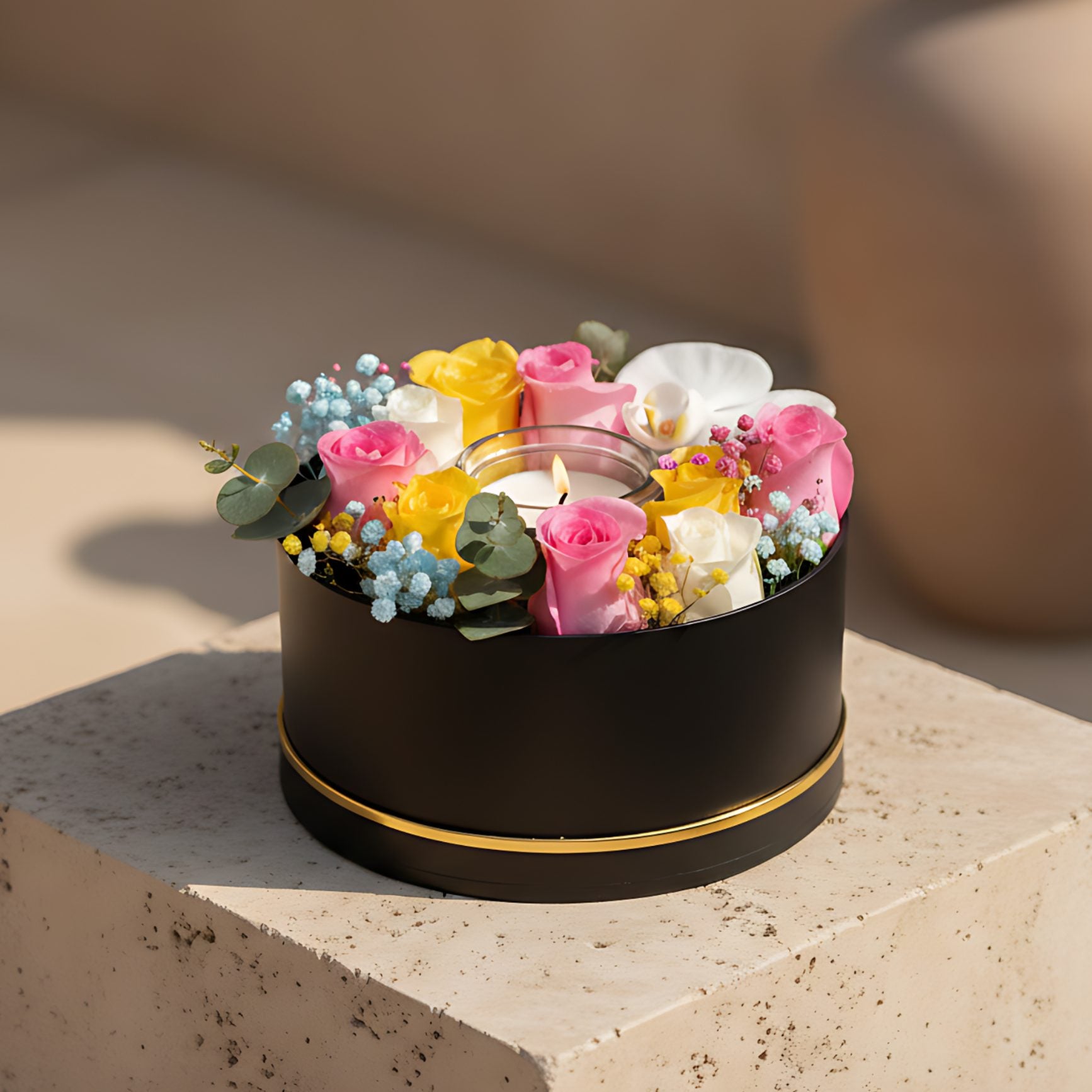 Vanilla Smell floral arrangement with mixed roses, white orchid and vanilla scented candle in black round box by Aiwa Flowers