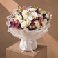 White roses, carnations, orchid & lilies with burgundy eucalyptus in white wrap - Velour Sky by AIWA Flowers
