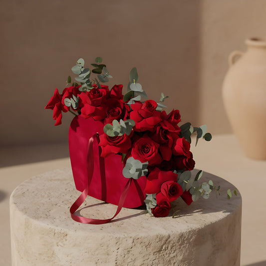 Velvet Valentine red velvet heart box with 25 fresh red roses and eucalyptus