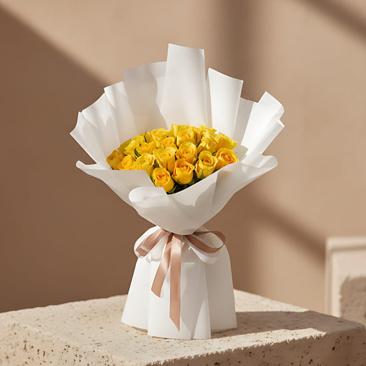 Venice hand-tied bouquet with 25 fresh yellow roses in white wrapping by Aiwa Flowers