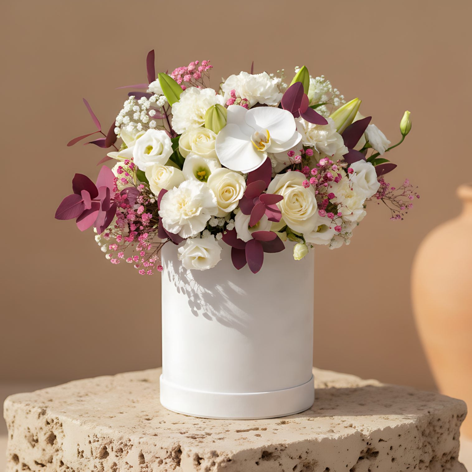 Vermeer white velvet flower box with white roses, lilies, orchid, lisianthus and purple gypsophila