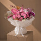 Pink roses, magenta orchids, hydrangea and gold palm accents in white wrap – Versailles Garden by AIWA Flowers