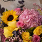 Close-up of pink hydrangea, sunflowers, pink and yellow roses - Ultra by AIWA Flowers