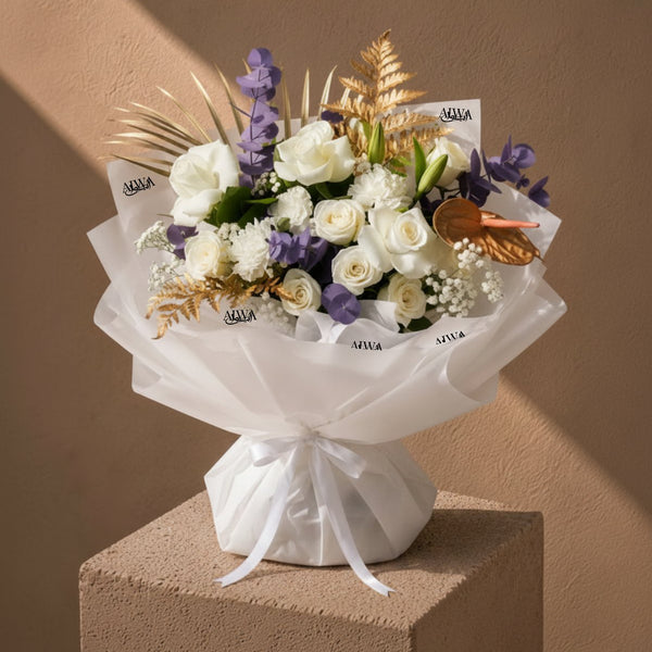 White roses, carnations and purple-dyed eucalyptus with gold accents in white wrap — White Velvet, AIWA Flowers