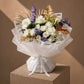 White roses, carnations and purple-dyed eucalyptus with gold accents in white wrap — White Velvet, AIWA Flowers
