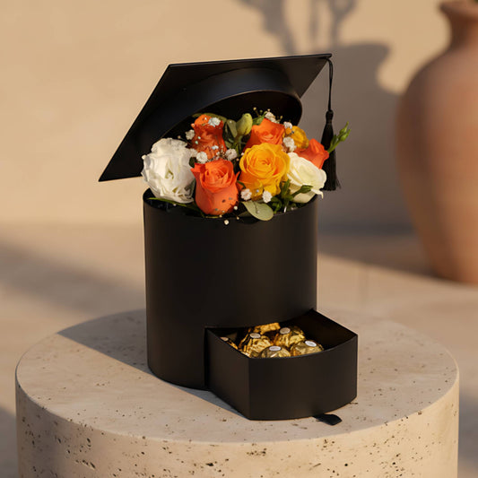 You Did It graduation hat box with orange and yellow roses, lisianthus, eucalyptus and Ferrero Rocher chocolate