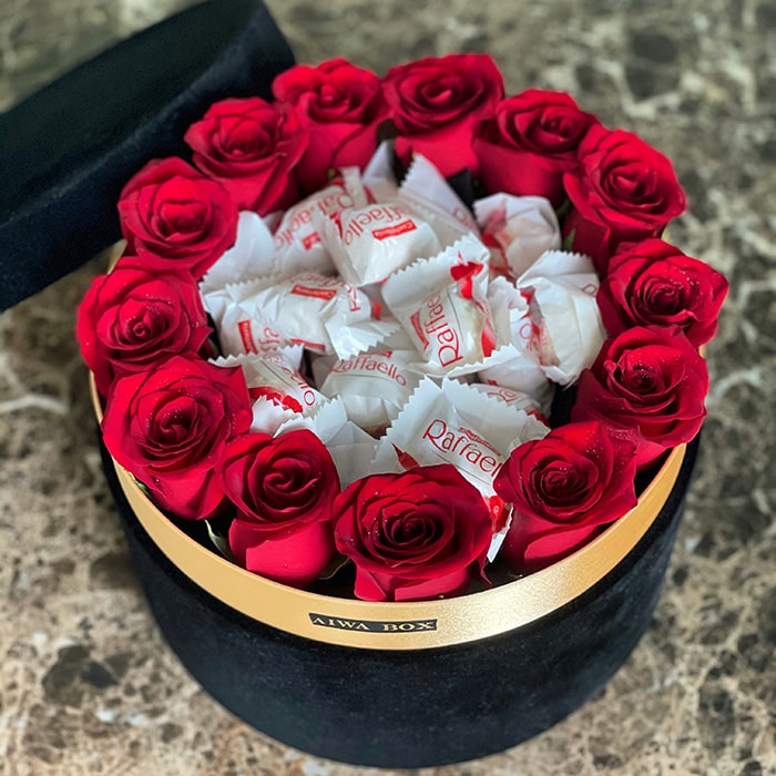 Red Roses in a Black Velvet Round Box