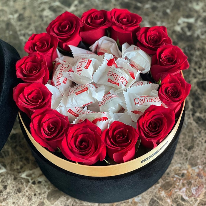 Red Roses in a Black Velvet Round Box